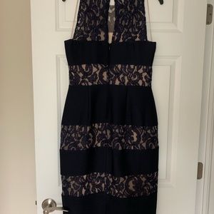 Like new navy blue with tan under lay